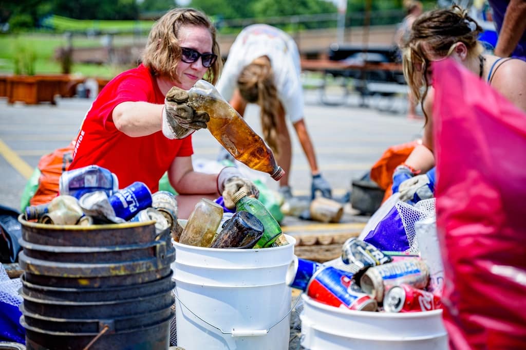 Club members sorting waste into bins after a cleanup drive